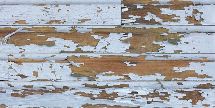 Old lead paint peeling off of wood siding