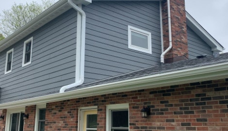 LP SmartSide siding, Atlas Pinnacle shingle roofing and guttering in Hinsdale project photo 2