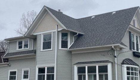 Royal Estate siding installation and shingle roof replacement in Arlington Heights project photo 1