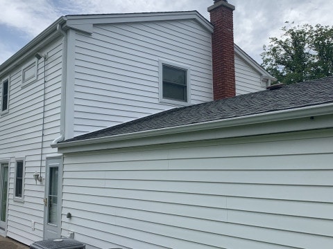 Vinyl siding installation & gutters replacement after hail damage in Downers Grove project photo