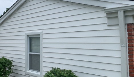 Vinyl siding installation & gutters replacement after hail damage in Downers Grove project photo 4