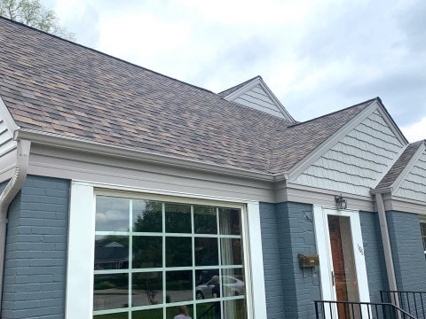 Vinyl siding installation and shingle roof replacement after hail damage in Clarendon Hills project photo