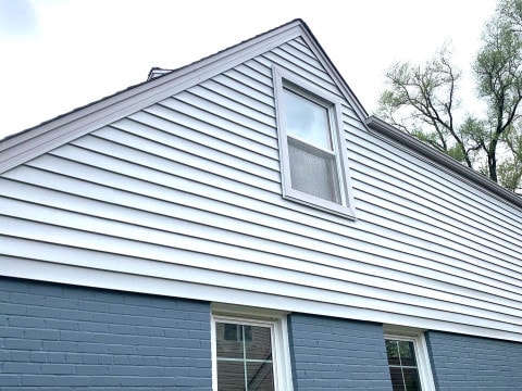 Vinyl siding installation and shingle roof replacement after hail damage in Clarendon Hills project photo 3