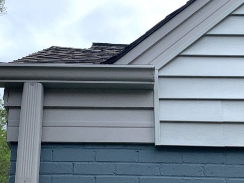 Vinyl siding installation and shingle roof replacement after hail damage in Clarendon Hills project photo 4