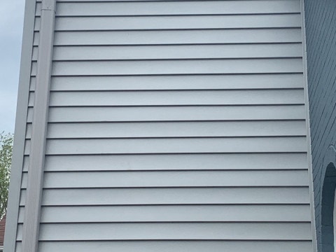 Vinyl siding installation and shingle roof replacement after hail damage in Clarendon Hills project photo 6