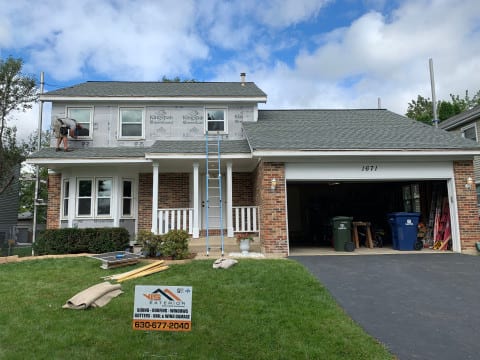Full exterior remodeling vinyl siding installation shingle roof replacement in Naperville before after project photo 11