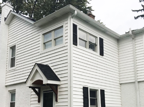 White prodigy double 6” vinyl siding and roofing project photo in Lombard