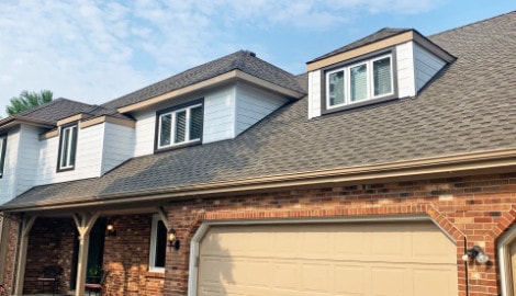Cedar siding installation and GAF shingle roofing in Downers Grove project photo 1