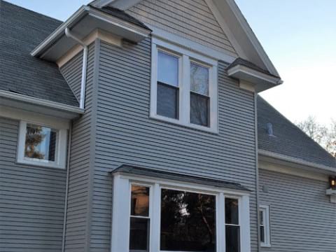 Exterior remodeling vinyl siding installation roof replacement in Arlington Heights project photo 1