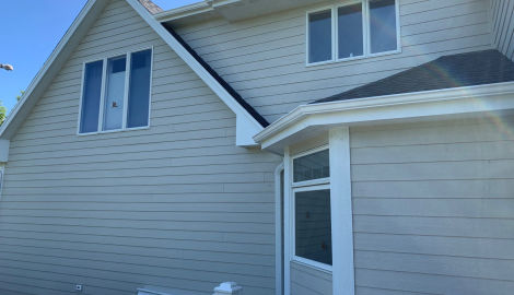 LP SmartSide ExpertFinish siding installation and guttering in St. Charles project photo 3