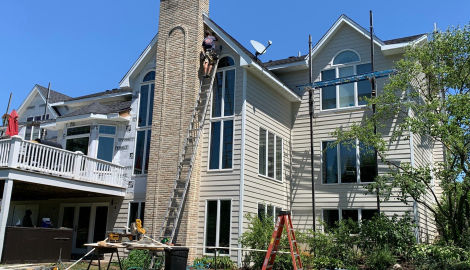 LP SmartSide ExpertFinish siding installation and guttering in St. Charles project photo 9