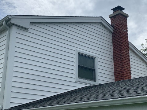 Vinyl siding installation & gutters replacement after hail damage in Downers Grove project photo 2