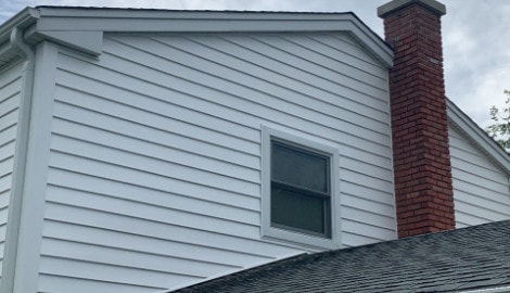 Vinyl siding installation & gutters replacement after hail damage in Downers Grove project photo 2