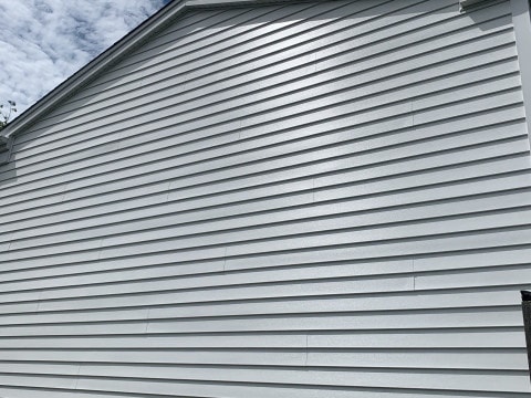 Vinyl siding installation & gutters replacement after hail damage in Downers Grove project photo 3