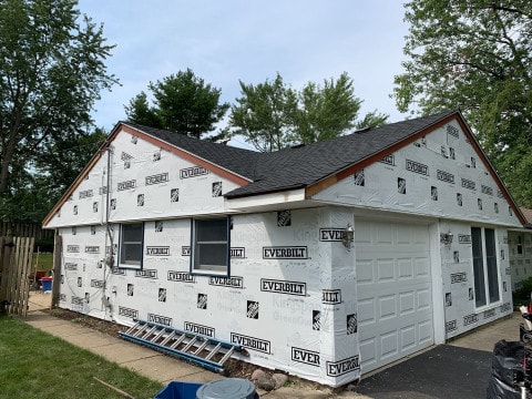 Vinyl siding and shingle roof replacement after hail damage in Woodridge project photo 6