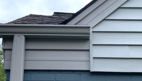 Vinyl siding installation and shingle roof replacement after hail damage in Clarendon Hills project photo 4